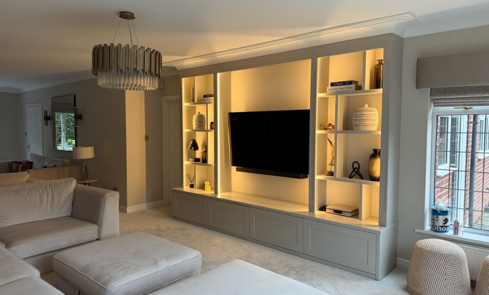 Minimalist living room with bespoke lit media wall
