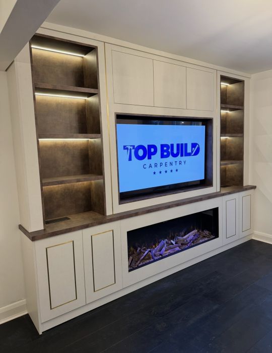 Media wall with tv, shelves and fire